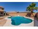 The sparkling backyard pool is surrounded by a concrete deck and mature desert landscaping at 12571 W Clarendon Ave, Avondale, AZ 85392