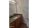 Clean bathroom featuring vanity with granite counter and tile flooring at 1336 E Mountain View Rd # 209, Phoenix, AZ 85020