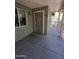 Covered entryway featuring security door, unit number, and access to outdoor walkway at 1336 E Mountain View Rd # 209, Phoenix, AZ 85020