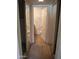 Hallway featuring closet with mirrored doors leading to a bathroom at 1336 E Mountain View Rd # 209, Phoenix, AZ 85020