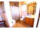 Clean bathroom with tile floors, vanity sink, and shower with curtain at 1384 E Las Colinas Dr, Chandler, AZ 85249
