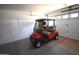Garage with ample storage, including custom cabinets and new golf cart at 1384 E Las Colinas Dr, Chandler, AZ 85249