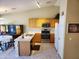 Bright kitchen with stainless steel appliances, oak cabinets and a breakfast bar at 1384 E Las Colinas Dr, Chandler, AZ 85249