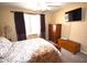 Spacious main bedroom with large window, flatscreen TV, and neutral colored walls at 1384 E Las Colinas Dr, Chandler, AZ 85249