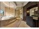 Well appointed bathroom featuring soaking tub, glass shower and vanity area at 1423 E Beverly Ln, Phoenix, AZ 85022