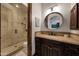 Bathroom featuring a glass shower, vanity with marble countertop, and tile flooring at 1423 E Beverly Ln, Phoenix, AZ 85022