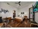 Comfortable bedroom with hardwood floors, ceiling fan, and recessed lighting at 1423 E Beverly Ln, Phoenix, AZ 85022