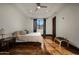 Inviting bedroom with hardwood floors, ceiling fan, and natural light from the window at 1423 E Beverly Ln, Phoenix, AZ 85022