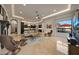 Bright living room featuring fireplace, modern furniture, and views to patio at 1423 E Beverly Ln, Phoenix, AZ 85022