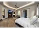 Tranquil main bedroom featuring wood floors, fireplace and doors to backyard at 1423 E Beverly Ln, Phoenix, AZ 85022