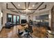 Beautiful office space with custom cabinetry and wood floors provides a luxurious workspace at 1423 E Beverly Ln, Phoenix, AZ 85022
