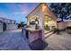 Outdoor kitchen with a built-in grill, bar seating, and ample counter space, perfect for al fresco dining at 1423 E Beverly Ln, Phoenix, AZ 85022