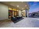 Covered patio area with stylish seating and a cozy fire pit, perfect for entertaining and enjoying the outdoors at 1423 E Beverly Ln, Phoenix, AZ 85022
