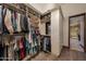 Walk-in closet with custom shelving and rod system at 1423 E Beverly Ln, Phoenix, AZ 85022