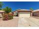 Attractive single-story home with a tile roof and a two-car garage at 16112 W Buchanan St, Goodyear, AZ 85338