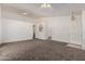 Spacious living room features an open floor plan and neutral color palette at 16112 W Buchanan St, Goodyear, AZ 85338