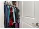 Well-organized closet with hanging clothes and storage for various items; featuring a functional design at 16906 W Palm Ln, Goodyear, AZ 85395