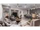 Open-concept living room flows into the kitchen, complete with recessed lighting, ceiling fan, and barstool seating at 16906 W Palm Ln, Goodyear, AZ 85395