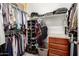 Functional walk-in closet offers ample shelving and hanging space for organized storage at 16906 W Palm Ln, Goodyear, AZ 85395