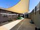 Covered back patio with sun shade, perfect for outdoor activities and relaxation at 1720 E Intrepid Ave, Mesa, AZ 85204