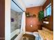 Bathroom features granite countertop vanity, hanging plant and tiled shower at 1720 E Intrepid Ave, Mesa, AZ 85204