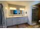 Modern bathroom with dual sinks, granite countertops, and tiled shower at 1720 E Intrepid Ave, Mesa, AZ 85204