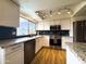 Well-equipped kitchen features stainless steel appliances and granite countertops at 1720 E Intrepid Ave, Mesa, AZ 85204