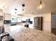 Modern kitchen features stainless steel appliances, granite countertops, and a sunlit window at 1720 E Intrepid Ave, Mesa, AZ 85204