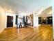 An open floor plan with wood floors, decorative wall art, and a cozy fireplace at 1720 E Intrepid Ave, Mesa, AZ 85204