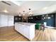Open concept living room showcasing the kitchen island, fireplace, and ample space at 1720 E Intrepid Ave, Mesa, AZ 85204