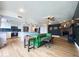 Spacious living room featuring a stone fireplace, an island, and hardwood flooring at 1720 E Intrepid Ave, Mesa, AZ 85204