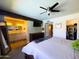 Spacious main bedroom with ensuite bath, walk-in closet, and ceiling fan at 1720 E Intrepid Ave, Mesa, AZ 85204