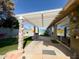 Charming covered patio featuring stone pillars and ample space for outdoor dining and entertaining with views of the pool at 1720 E Intrepid Ave, Mesa, AZ 85204