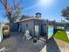 View of the property's functional side yard with gravel, storage, and other utilities at 1720 E Intrepid Ave, Mesa, AZ 85204