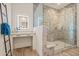 Bright bathroom with a glass shower, vanity with great lighting, and modern fixtures at 17396 W Crawfordsville Dr, Surprise, AZ 85388