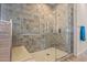 Modern bathroom featuring a glass-enclosed shower with stylish tile and built-in bench at 17396 W Crawfordsville Dr, Surprise, AZ 85388