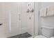 Stylish bathroom featuring a glass shower with sleek tile and modern fixtures at 17396 W Crawfordsville Dr, Surprise, AZ 85388
