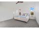 Cozy bedroom with great natural light, soft carpet, and plenty of open space at 17396 W Crawfordsville Dr, Surprise, AZ 85388