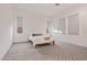 Bright bedroom with geometric patterned carpet and neutral color palette at 17396 W Crawfordsville Dr, Surprise, AZ 85388