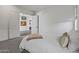 Spacious bedroom with doorway to another room, carpeted floor, and white walls at 17396 W Crawfordsville Dr, Surprise, AZ 85388