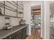 Butler's pantry area with countertop, appliances, and shelving at 17396 W Crawfordsville Dr, Surprise, AZ 85388
