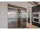 Gourmet kitchen with stainless steel refrigerator and wine cooler at 17396 W Crawfordsville Dr, Surprise, AZ 85388