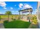 Backyard featuring an outdoor grill, ample counter space, and a lovely view of the golf course at 17396 W Crawfordsville Dr, Surprise, AZ 85388