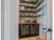Walk-in pantry with beverage refrigerator at 17396 W Crawfordsville Dr, Surprise, AZ 85388