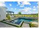 Stunning pool area with outdoor kitchen and serene golf course views offers the perfect relaxation spot at 17396 W Crawfordsville Dr, Surprise, AZ 85388