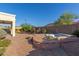 Backyard featuring a fire pit and hot tub, perfect for outdoor entertaining at 17517 W Dahlia Dr, Surprise, AZ 85388