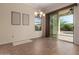 Bright dining area featuring tile floors, decorative art and sliding doors to the patio at 17517 W Dahlia Dr, Surprise, AZ 85388