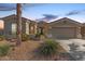 Charming single-story home featuring a well-manicured front yard and inviting entryway at 17517 W Dahlia Dr, Surprise, AZ 85388