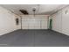 Spacious garage with a pegboard wall system for storing tools and equipment at 17517 W Dahlia Dr, Surprise, AZ 85388