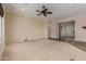 Open-concept living room with ceiling fan and neutral color palette at 17517 W Dahlia Dr, Surprise, AZ 85388